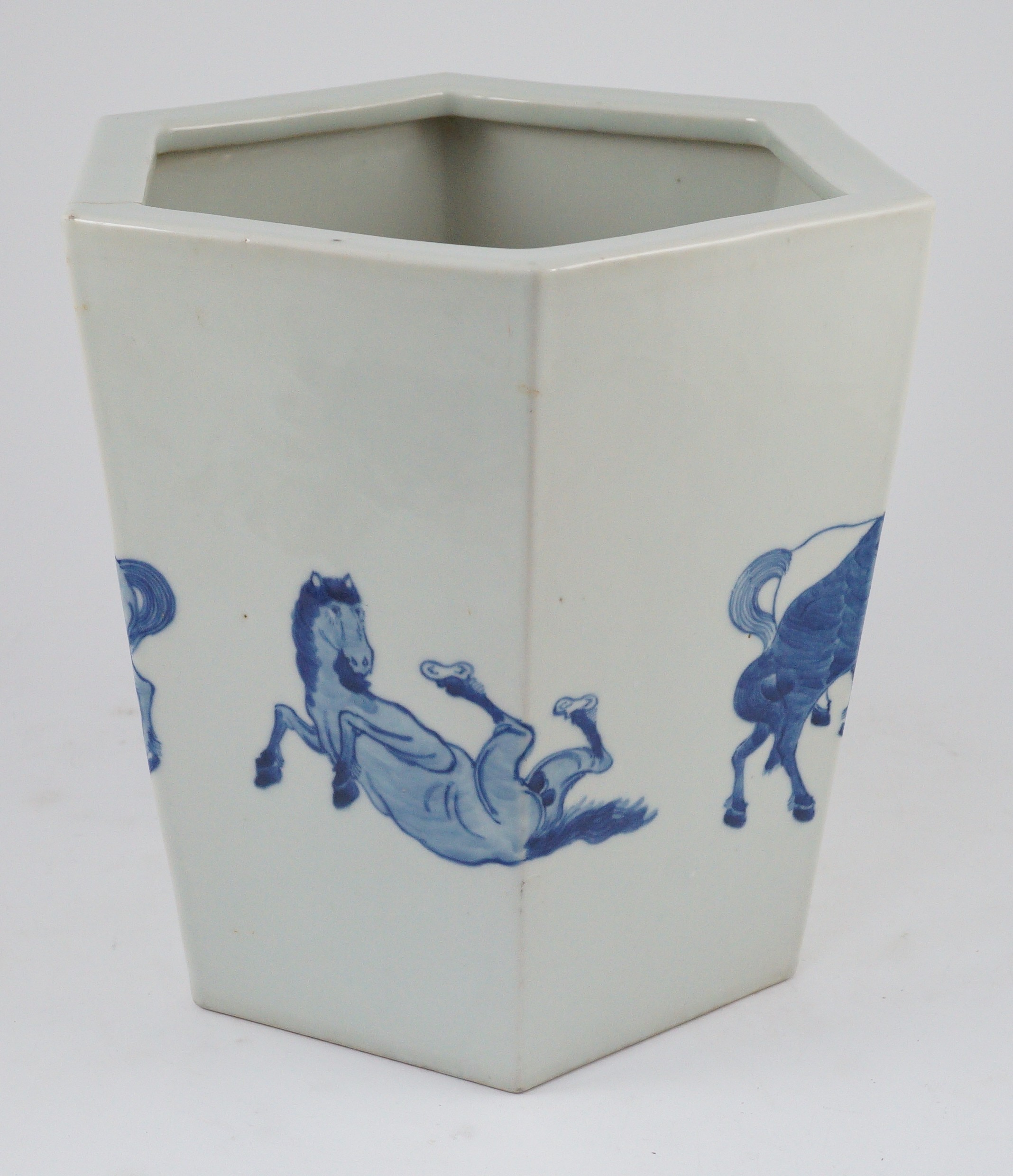 A Chinese blue and white hexagonal jardiniere, Kangxi mark but 19th/20th century, 26.5cm high, 28cm wide, cracked